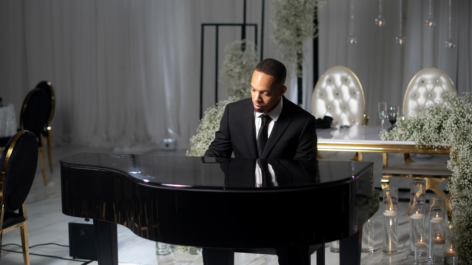 Jerel Crockett at the luxury portable grand piano shell, staged at a wedding reception